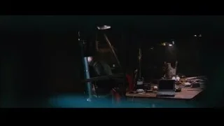 dark room with cluttered desk — Iron Man