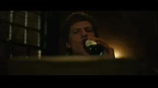 Young man looking out barred window — The Social Network