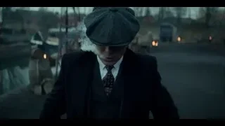 man in suit walking in industrial area — Peaky Blinders