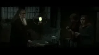 Three people in dimly lit tavern — Harry Potter and the Deathly Hallows 2