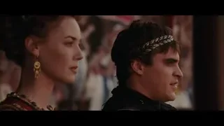woman in red gold dress serious — Gladiator