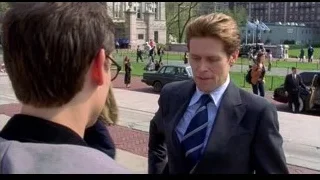 young men standing on city sidewalk — Spider Man