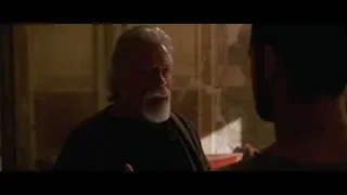two men conversing in dimly lit room — Gladiator