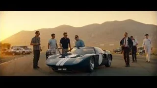 Men around blue sports car — Ford v Ferrari