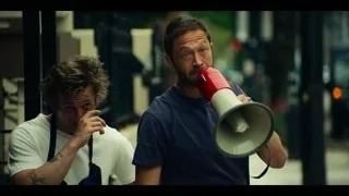 man with megaphone in kitchen — The Bear