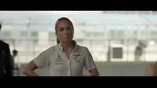 woman in Mercedes F1 shirt at race track — F1