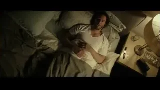 man lying in bed deep in thought — John Wick