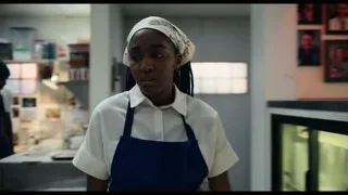 woman in blue apron in kitchen — The Bear