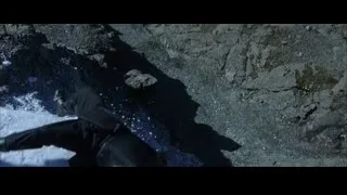 person lying unconscious on snowy rocky ground — Batman
