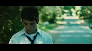 young man with head in hands on street — Whiplash