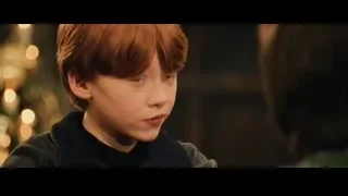 boy with serious expression by Christmas tree — Harry Potter and the Philosophers Stone