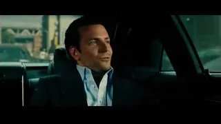 man in suit sitting in car on city street — Limitless