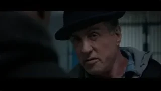 Man's face with fedora and mustache — Creed