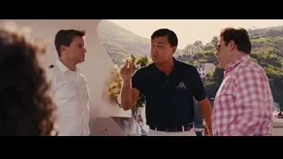 three men standing with mountain view — The Wolf Of Wall Street
