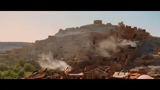 ancient structure with flags in desert — Gladiator