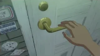 Hand holding golden door handle — Weathering with You