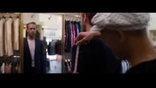 Two men examining clothes in store — La La Land