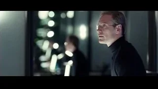 Man in turtleneck looking out city window — Steve Jobs