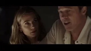 man and woman in dimly lit room — F1