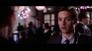 man in suit in crowded room — Spider Man 2