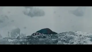 man crouching on snowy rocky surface — Superman: Man of Steel