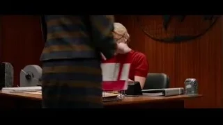 hand holding red folder — Ford v Ferrari