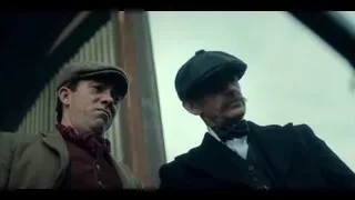 Two men looking out car window — Peaky Blinders