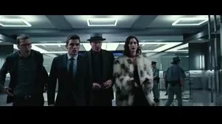 woman in fur coat and man with gun — Now You See Me 2