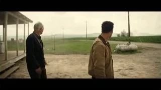 two men facing in rural area — Interstellar