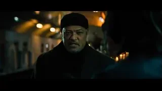 man with beard in dimly lit room — John Wick: Chapter 4