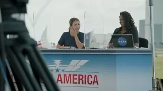 People at desk with NASA America laptop — Elon Musk: Return to Space