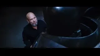 bald man with large black object — Iron Man