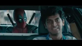 man driving car with Deadpool in back — Deadpool 2