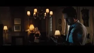 man looking at phone, woman with book — Now You See Me