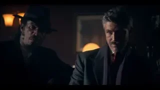 two men sitting in dimly lit room — Peaky Blinders