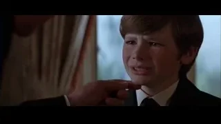 Young boy in suit crying by window — Batman