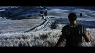 Person walking on dirt road in vast landscape — Gladiator