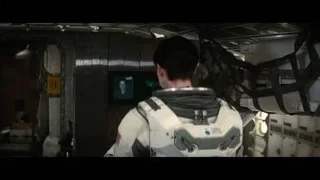 man in space suit looking at screen — Interstellar