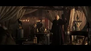 man standing in dimly lit throne room — Gladiator