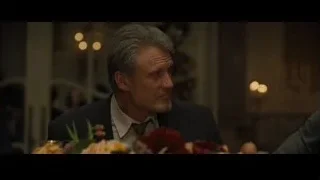 Man in suit at formal table with flowers — Creed 2