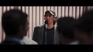 Young man speaking into microphone — The Wolf Of Wall Street
