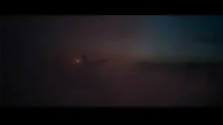 Airplane flying above clouds at sunset — The Amazing Spider Man 2