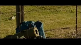 backpack and duffel bag by barbed wire fence — Into the Wild