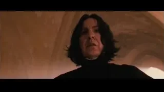 Man in black robe in dimly lit room — Harry Potter and the Philosophers Stone