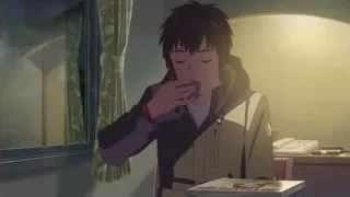 Young man at desk looking at camera — Your Name