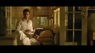 Young man on bed with laptop — The Social Network
