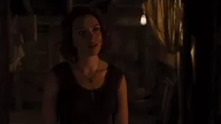 Young woman in dimly lit cluttered room — The Avengers
