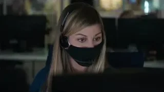 Woman working at computer with mask and headset — Elon Musk: Return to Space
