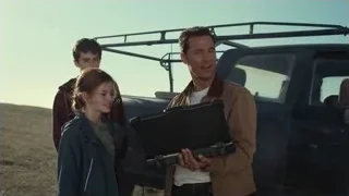 three people by black pickup truck — Interstellar