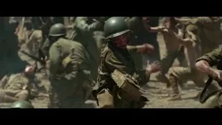 Soldier kneeling and firing rifle — Hacksaw Ridge